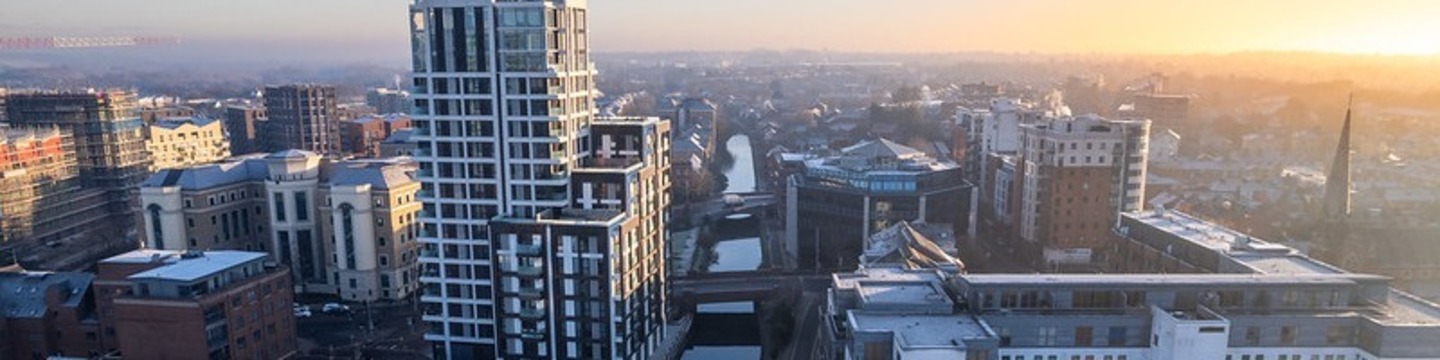 An image of Reading's skyline, tall buildings in the sunrise